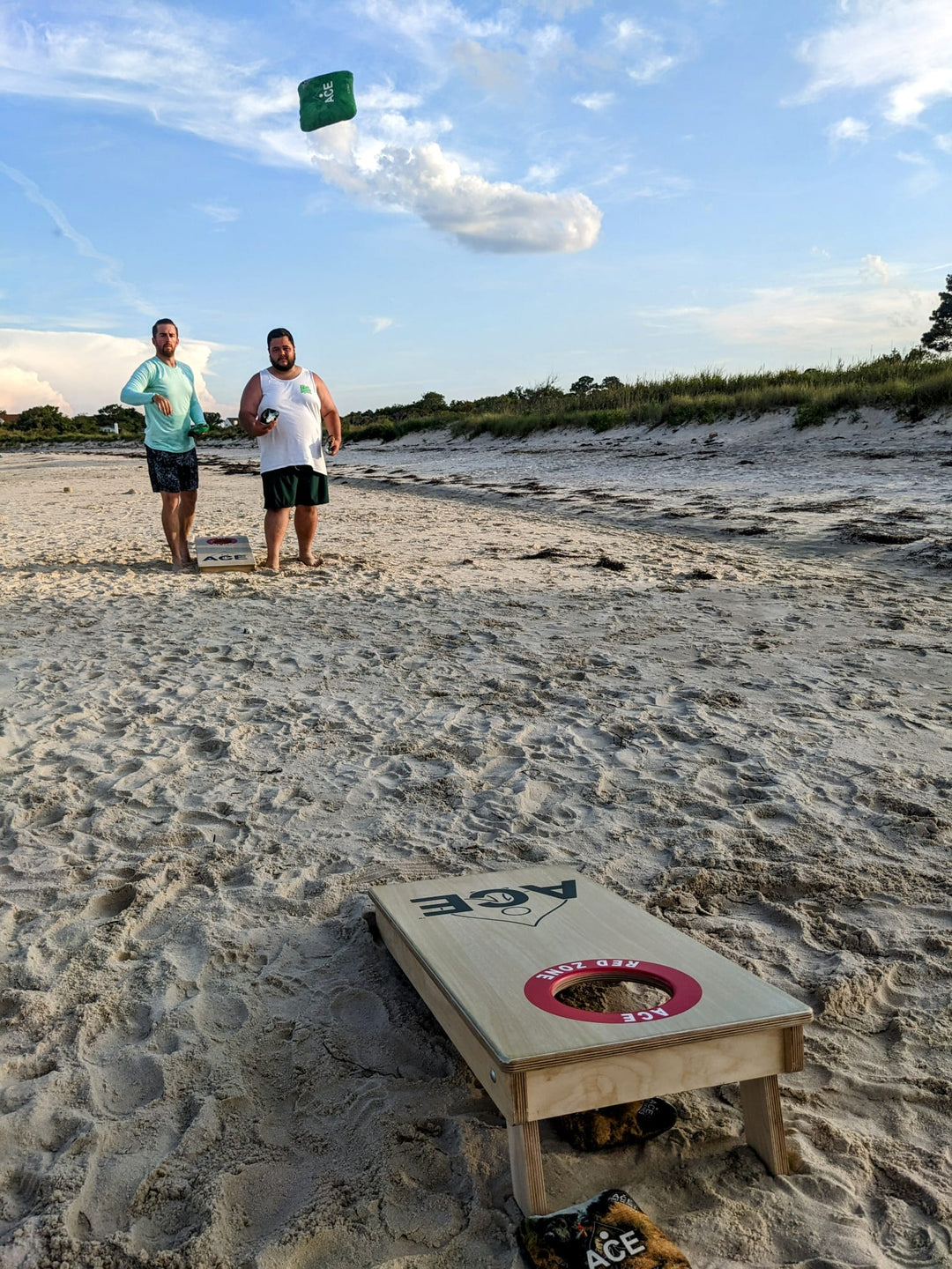 Mini Cornhole Boards play at the beach